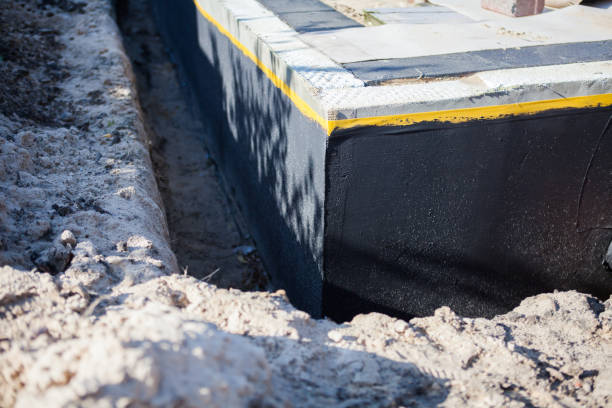 Professional Interior Drainage System technician working in Hall, NY